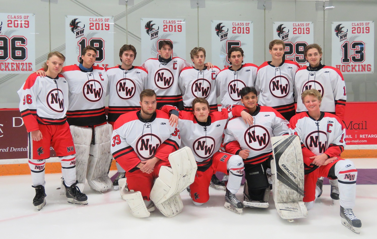 The 12 Niagara-Wheatfield Falcons hockey seniors pose prior to a game versus Frontier. (Photos by David Yarger)
